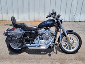 2009 Harley Davidson
Sportster XL883L
Dark Blue Pearl with 8,210 miles
Equipped with 1200cc kit, 5-speed transmission, forward controls, Vance & Hines exhaust, Saddleman seat, saddlebags, passenger backrest with luggage rack and more!  Financing and warranty are available.
Hawg Pen Price $5,995.00