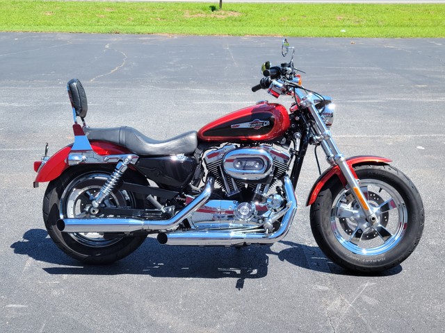 2013 Harley Davidson
Sportster XL1200C
Two-tone Candy Orange & Beer Bottle
Fuel-injected with 9,387 miles
Equipped with 1200cc motor, 5-speed transmission, passenger backrest and more!  Financing and warranty are available.  
Hawg Pen Price $6,995.00