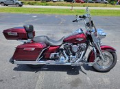 2014 Harley Davidson
Road King FLHR
Mysterious Red Sunglo with 6,387 miles
Equipped with 103